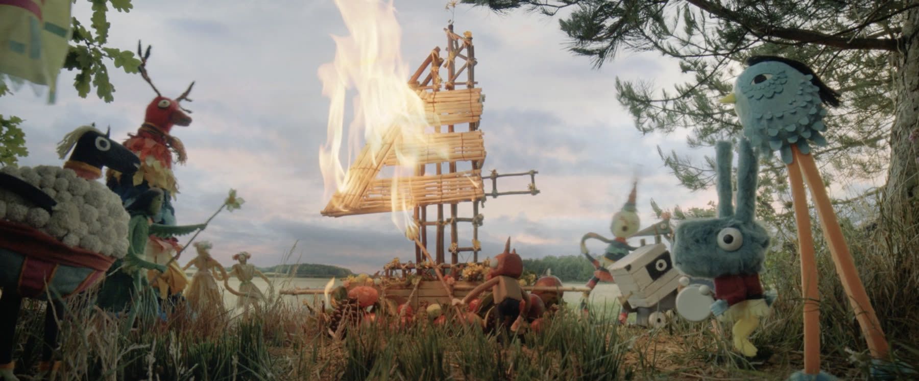 Puppet village burning a giant E4 effigy, from the E4igy ident