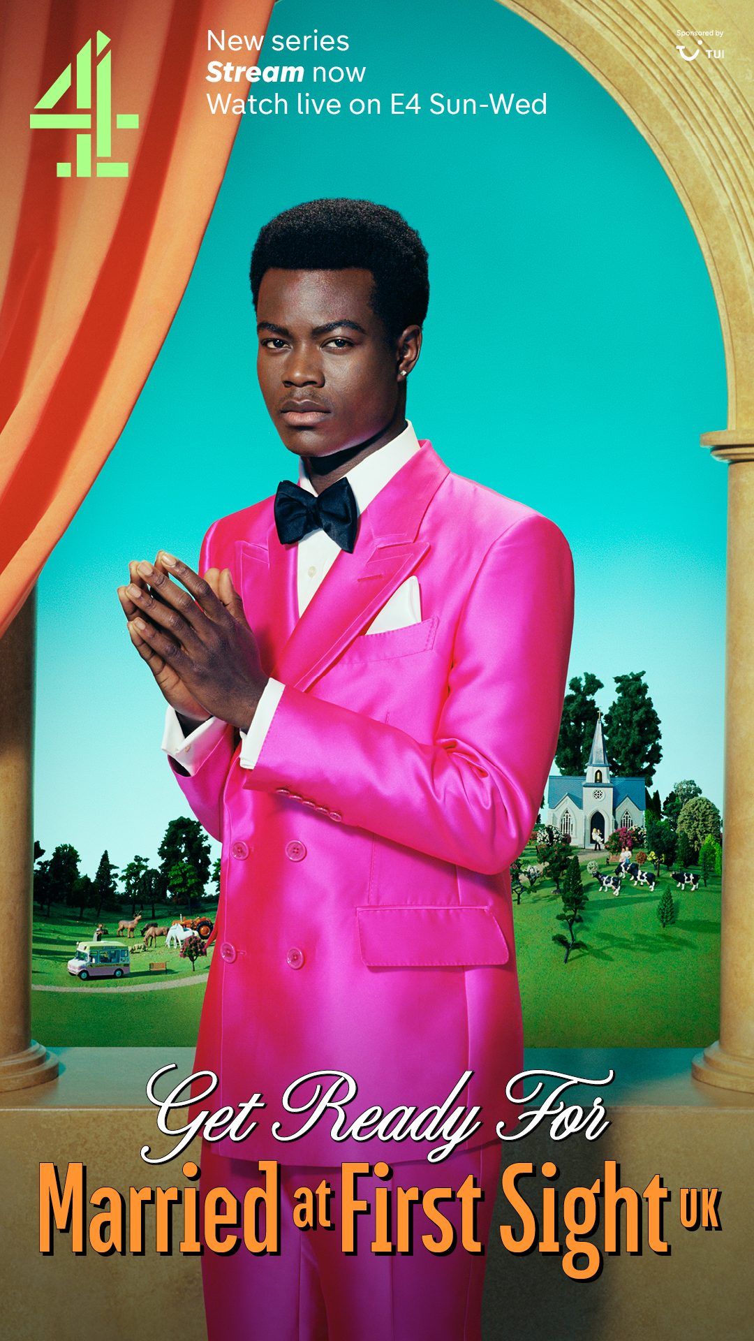 Groom in a hot-pink satin suit framed by a red curtain and golden arch